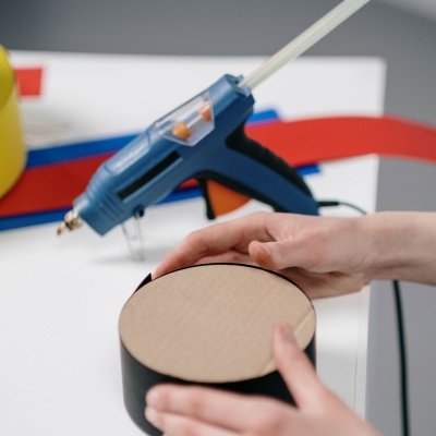 Using hot glue gun with EVA hot melt glue stick for manual assembly bonding