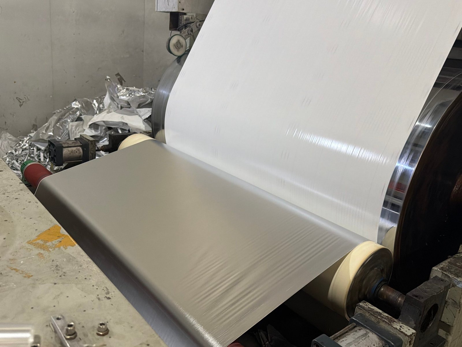 PVC Self‑Adhesive Film PVC self‑adhesive film on production machine, adhesive pvc foil production