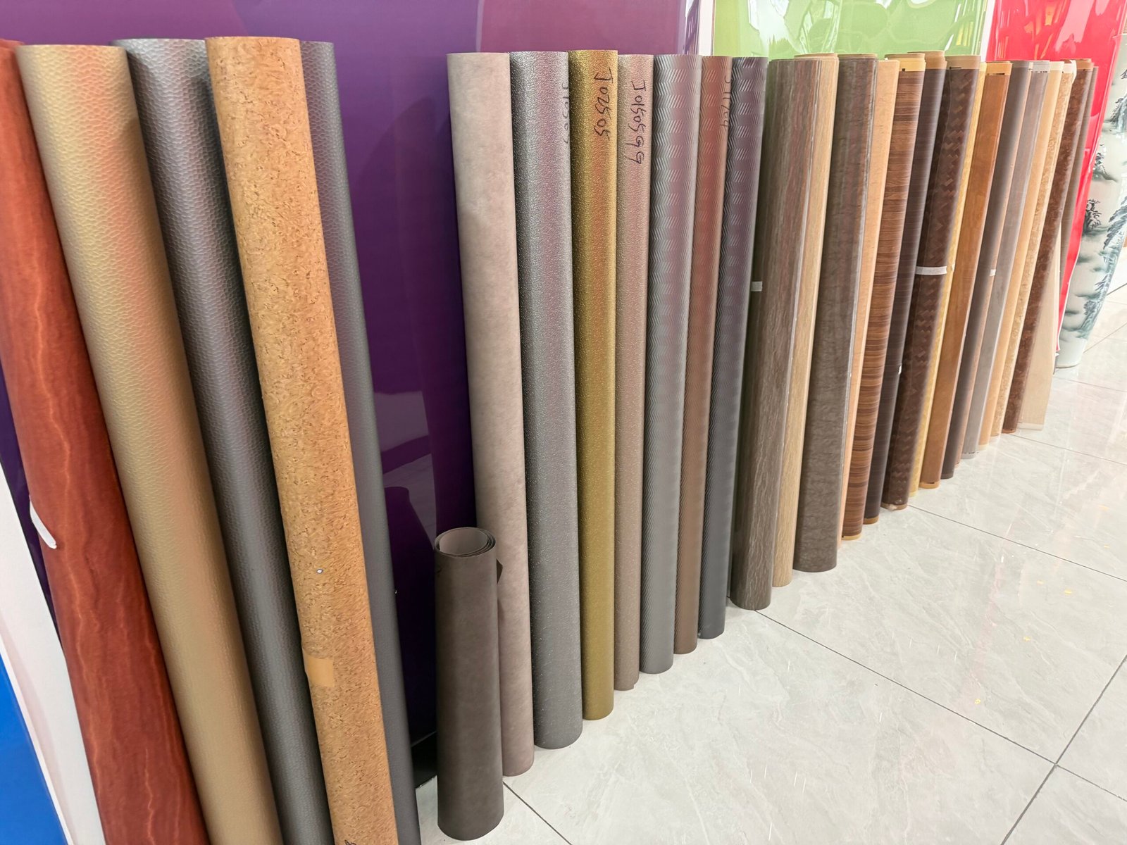 Display sample boards of multi‑pattern PVC film for furniture