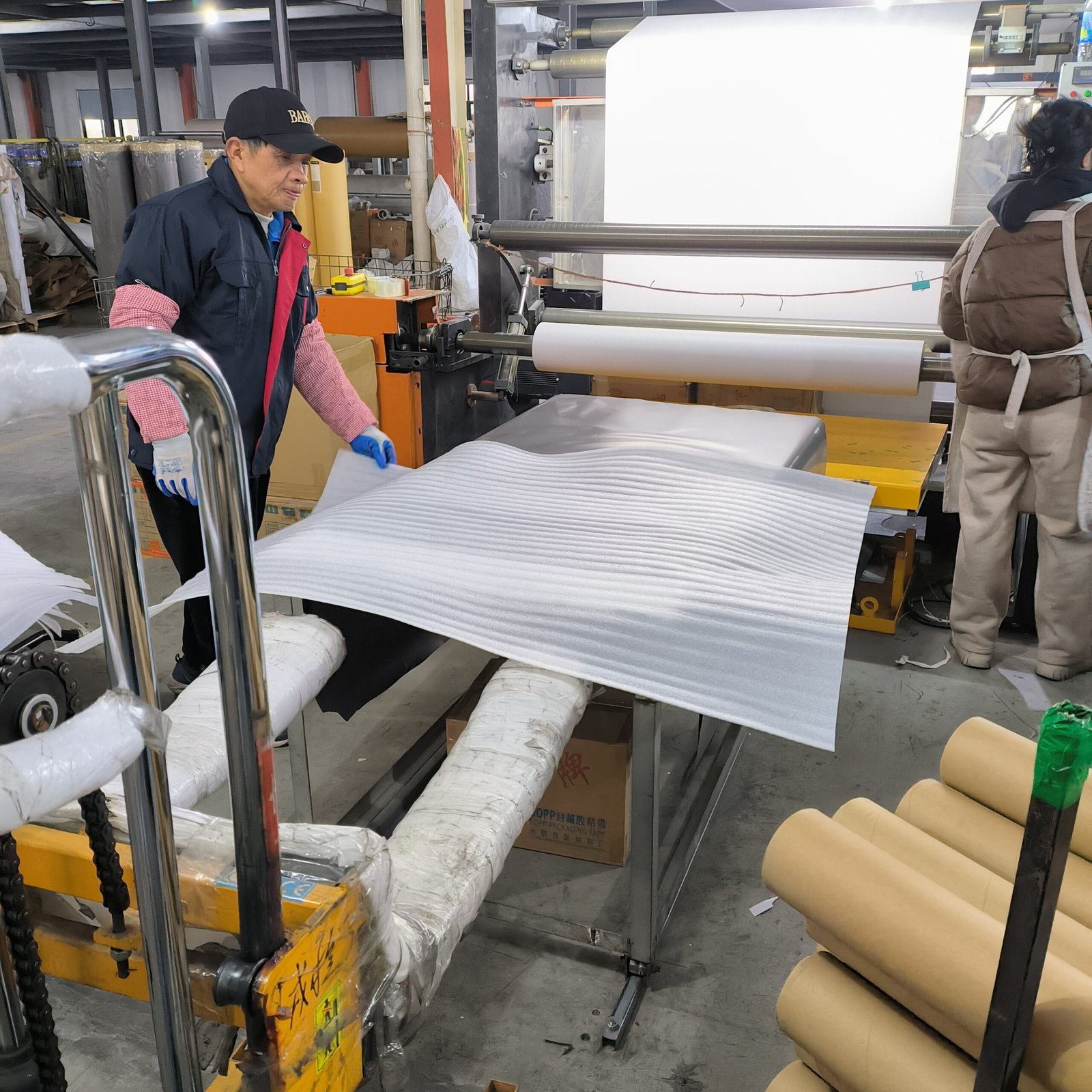 Quality Inspection Workers performing quality check for pvc foil products