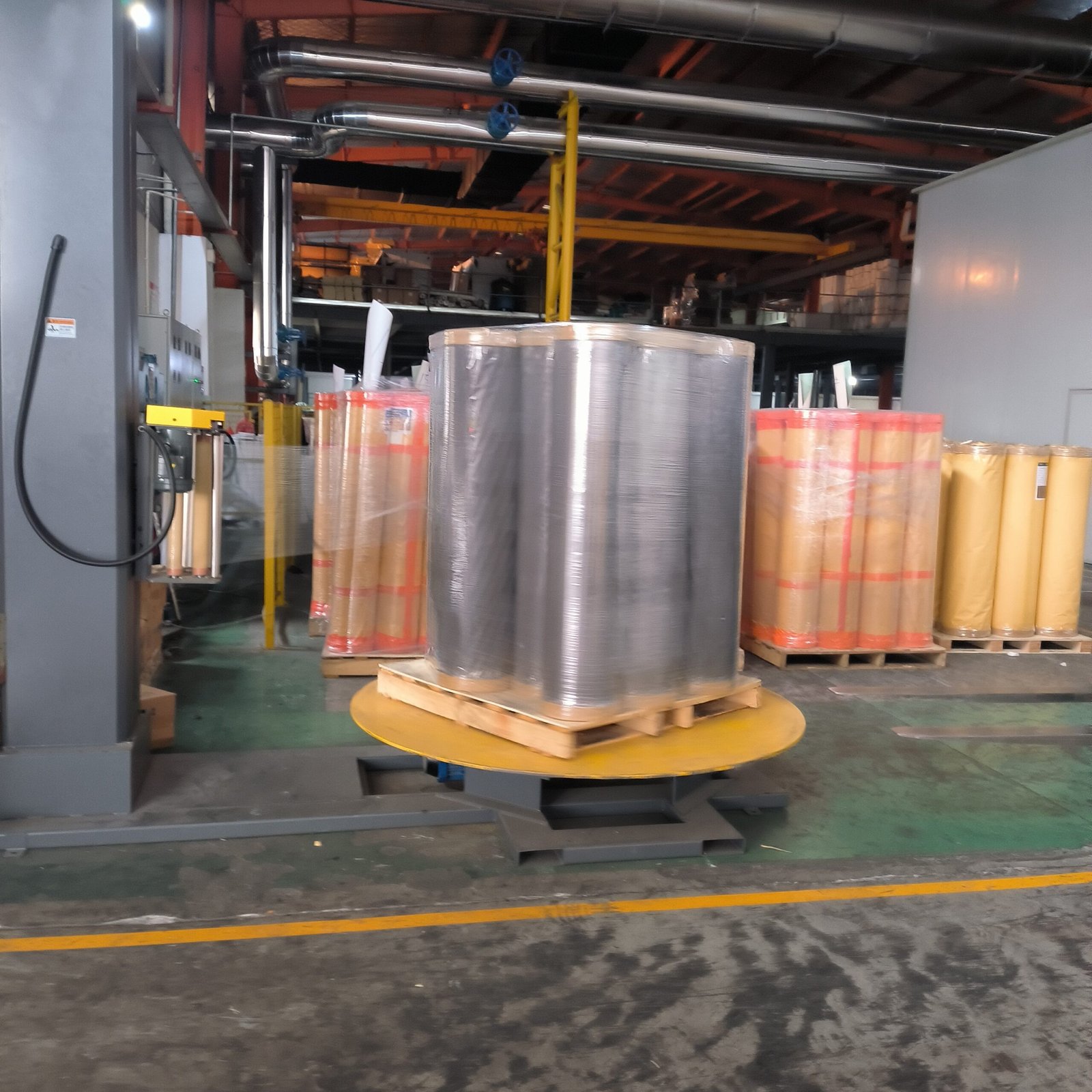 Roll Packaging Pallet wrapping for finished pvc foil rolls in warehouse