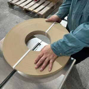 Workers pack edge banding strips