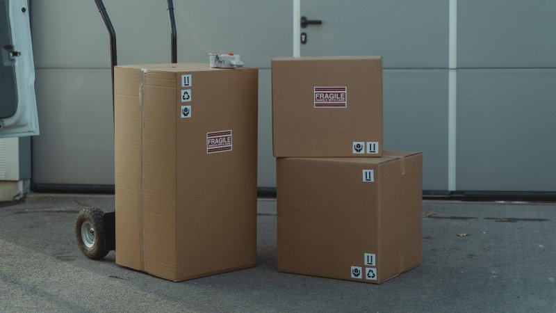 Carton sealing with hot melt adhesive