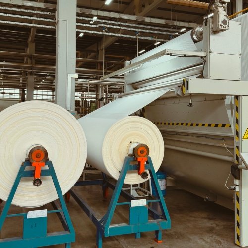Sponge and nonwoven fabric lamination with HMPSA