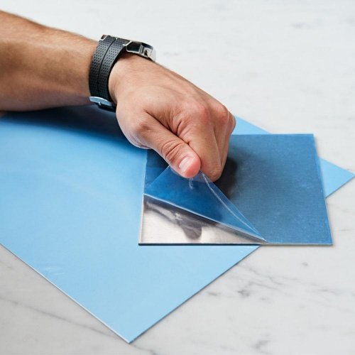 Protective films with HMPSA adhesive
